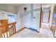 Upstairs hallway featuring carpeting and access to rooms at 2621 S Kingston Ct, Aurora, CO 80014