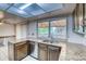 View of the kitchen featuring granite countertops, stainless steel appliances, and a window view at 2621 S Kingston Ct, Aurora, CO 80014