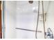 Clean and bright white shower with a sleek showerhead and accessibility bar at 2621 S Kingston Ct, Aurora, CO 80014