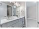 Double vanity bathroom with gray cabinets and quartz countertops at 3893 Freestone Pt, Castle Rock, CO 80108