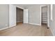 Spacious bedroom with light gray walls and hardwood floors at 3893 Freestone Pt, Castle Rock, CO 80108