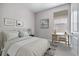 Well-lit bedroom with a desk area, ideal for a home office at 3893 Freestone Pt, Castle Rock, CO 80108