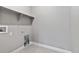 Laundry room with shelving, tile floor, and hookups at 3893 Freestone Pt, Castle Rock, CO 80108