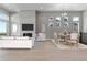 Combined living and dining area with hardwood floors, fireplace, and lots of light at 3893 Freestone Pt, Castle Rock, CO 80108