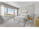 Main bedroom with large windows, plush bedding, and ample natural light at 3893 Freestone Pt, Castle Rock, CO 80108
