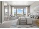 Main bedroom suite with large windows, a sitting area, and ensuite bathroom at 3893 Freestone Pt, Castle Rock, CO 80108