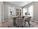 Bright home office featuring built-in shelving and comfortable seating at 3893 Freestone Pt, Castle Rock, CO 80108