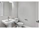 Clean powder room with pedestal sink and modern fixtures at 3893 Freestone Pt, Castle Rock, CO 80108