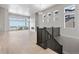 Elegant staircase with dark wood railing leading to upper level at 3893 Freestone Pt, Castle Rock, CO 80108