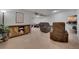 Finished basement with entertainment area and cozy seating, creating a versatile living space at 7557 S Cove Cir, Centennial, CO 80122