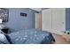 Bright bedroom featuring a full bed, closet, and plenty of natural light at 7557 S Cove Cir, Centennial, CO 80122