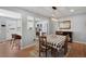 Dining area featuring an open layout, table with seating, and view into the kitchen, perfect for entertaining at 7557 S Cove Cir, Centennial, CO 80122