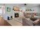 Cozy living room features a fireplace, plush seating, and neutral decor for a relaxing ambiance at 7557 S Cove Cir, Centennial, CO 80122