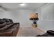 Cozy living room with plush leather seating, TV, and neutral decor for a relaxing ambiance at 7557 S Cove Cir, Centennial, CO 80122