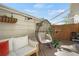 Cozy outdoor patio featuring comfortable seating, decorative plants, and string lights at 7557 S Cove Cir, Centennial, CO 80122