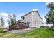 Spacious backyard with a deck, mature trees, and a well-maintained lawn at 21005 Glacier Park Cv, Parker, CO 80138