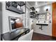 Modern bathroom vanity with black shelves, and decorative mirrors and lighting fixtures at 21005 Glacier Park Cv, Parker, CO 80138