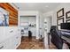 Bright bedroom featuring hardwood floors, a closet, and views to another room at 21005 Glacier Park Cv, Parker, CO 80138