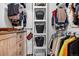 Organized closet with shelving, drawers, and hanging rods for efficient storage at 21005 Glacier Park Cv, Parker, CO 80138