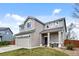 Attractive two-story home with a front porch, well-manicured lawn, and a two-car garage at 21005 Glacier Park Cv, Parker, CO 80138