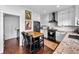 Modern kitchen featuring granite countertops, white cabinets, and stainless steel appliances at 21005 Glacier Park Cv, Parker, CO 80138