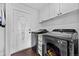 Laundry room with modern appliances and ample storage space at 21005 Glacier Park Cv, Parker, CO 80138