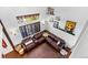 Bright living room featuring high ceilings, stylish décor, and hardwood flooring at 21005 Glacier Park Cv, Parker, CO 80138