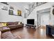 Spacious living room featuring high ceilings, stylish décor, and hardwood flooring at 21005 Glacier Park Cv, Parker, CO 80138