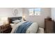 Cozy bedroom decorated with a neutral color scheme and stylish furnishings at 7902 Chase Cir # 152, Arvada, CO 80003