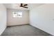 Bright bedroom featuring a ceiling fan, a window, and carpeted flooring at 7902 Chase Cir # 152, Arvada, CO 80003