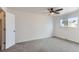 Spacious bedroom featuring a ceiling fan, a window, and a neutral color scheme at 7902 Chase Cir # 152, Arvada, CO 80003