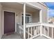 Inviting front entrance of the home with unit number 152 and a cozy porch at 7902 Chase Cir # 152, Arvada, CO 80003