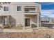 Exterior view of a two-story home showcasing a balcony and well-maintained front yard at 7902 Chase Cir # 152, Arvada, CO 80003