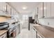 Updated kitchen with stainless steel appliances, a large sink, and well-maintained countertops at 7902 Chase Cir # 152, Arvada, CO 80003
