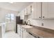 Well-lit kitchen featuring sleek appliances, a stainless steel sink, and ample countertop space at 7902 Chase Cir # 152, Arvada, CO 80003