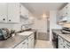 View of kitchen with white cabinets, stainless steel sink, and modern appliances at 7902 Chase Cir # 152, Arvada, CO 80003