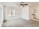 Spacious living room featuring neutral carpet, fresh paint, ceiling fan, and natural light at 7902 Chase Cir # 152, Arvada, CO 80003