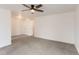Neutral colored room featuring plush carpet, ceiling fan, and multiple entry doors at 7902 Chase Cir # 152, Arvada, CO 80003