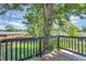 Relaxing back deck overlooking a lush backyard and mature trees, perfect for outdoor entertaining at 10863 W 67Th Pl, Arvada, CO 80004