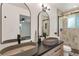 Elegant bathroom with dual vessel sinks, black fixtures, and a modern tiled shower at 10863 W 67Th Pl, Arvada, CO 80004