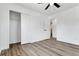 Empty bedroom showcasing new floors and a closet with sliding doors at 10863 W 67Th Pl, Arvada, CO 80004