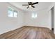 Bedroom with wood look flooring, ceiling fan, and great natural light at 10863 W 67Th Pl, Arvada, CO 80004