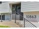 Close-up of front entrance, highlighting the wreath and house number at 10863 W 67Th Pl, Arvada, CO 80004