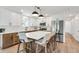 Kitchen with large island, stainless steel appliances, and modern lighting at 10863 W 67Th Pl, Arvada, CO 80004