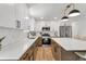 Bright kitchen boasts white cabinets, stainless appliances, and a spacious countertop at 10863 W 67Th Pl, Arvada, CO 80004