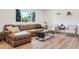 Comfortable living room featuring modern furniture and natural light at 10863 W 67Th Pl, Arvada, CO 80004
