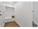 Inviting mud room featuring a built-in bench, coat hooks, storage, and durable wood flooring at 10863 W 67Th Pl, Arvada, CO 80004