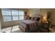 Cozy bedroom featuring a large window, comfortable bed, and charming decor at 16367 E Auburn Hills Dr, Parker, CO 80134