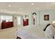 Bright bedroom featuring large windows, recessed lighting and neutral décor at 16367 E Auburn Hills Dr, Parker, CO 80134