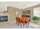 Warm and inviting dining room featuring a wood table, hutch, and a decorative chandelier at 16367 E Auburn Hills Dr, Parker, CO 80134